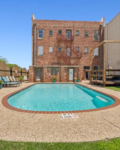 The Eastland Historic Hotel brick building and pool from the courtyard